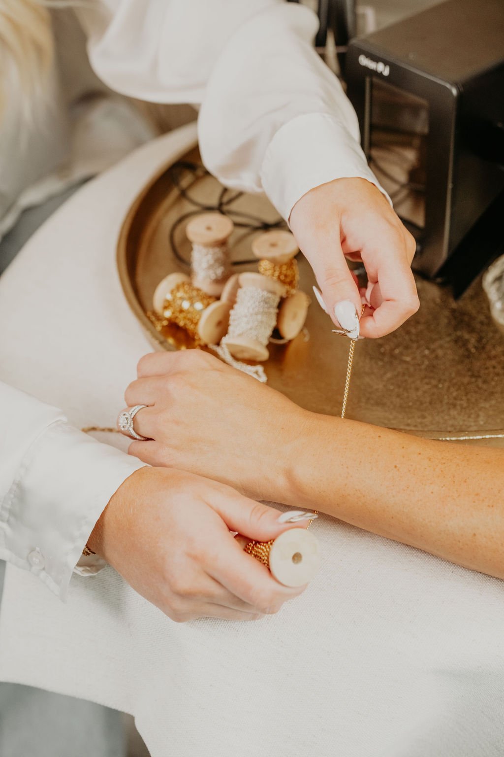 Artisan crafting permanent jewelry